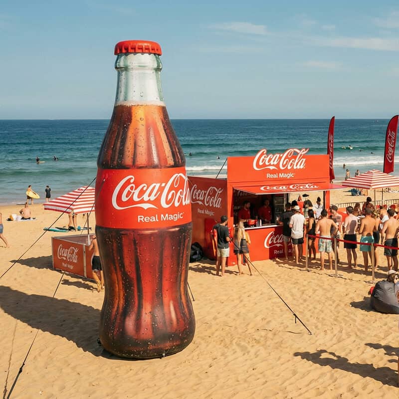 Giant Coca Cola inflatable bottle at beach